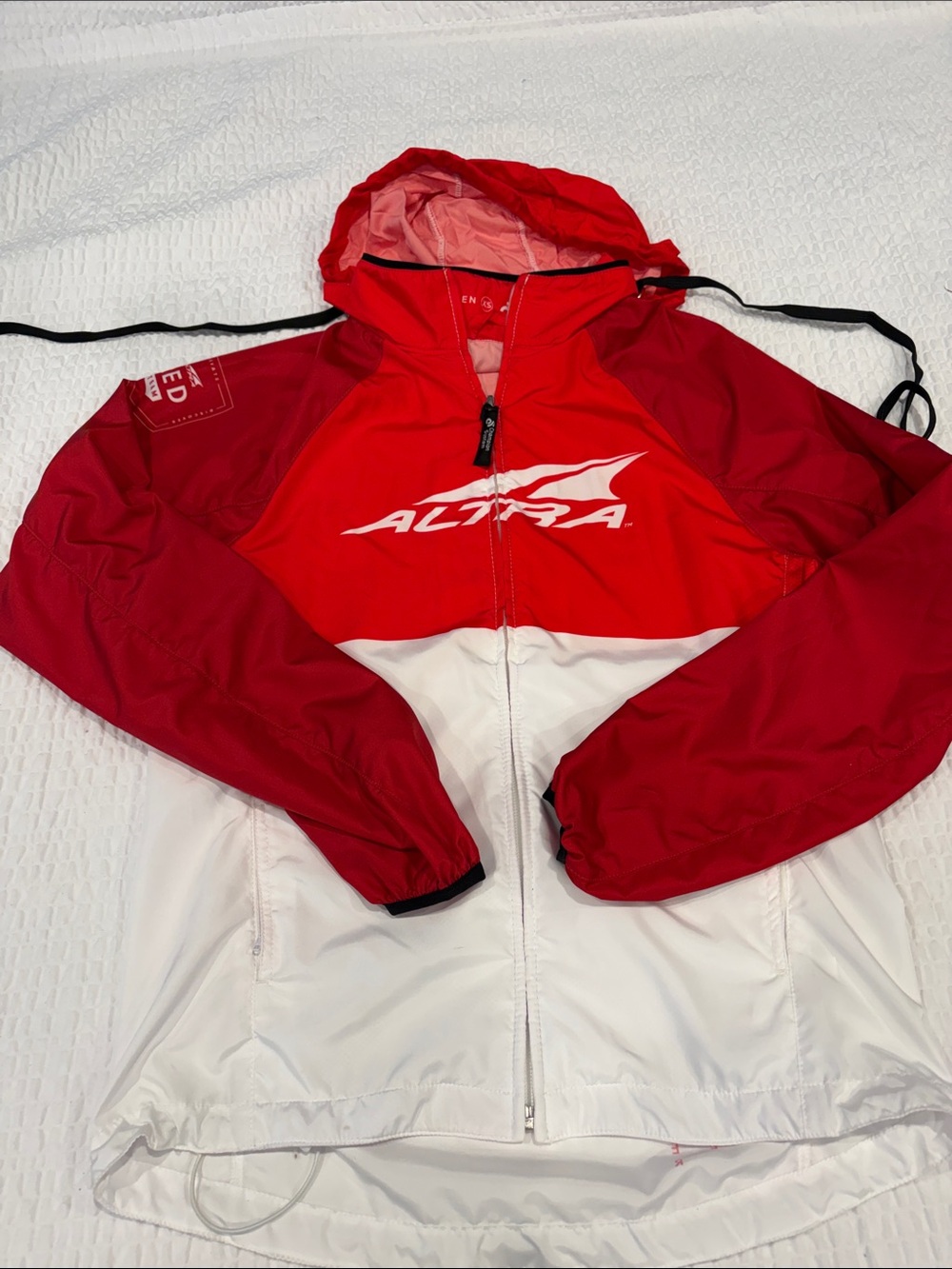 Altra Ladies Red and White Hooded Running Jacket
Size XS